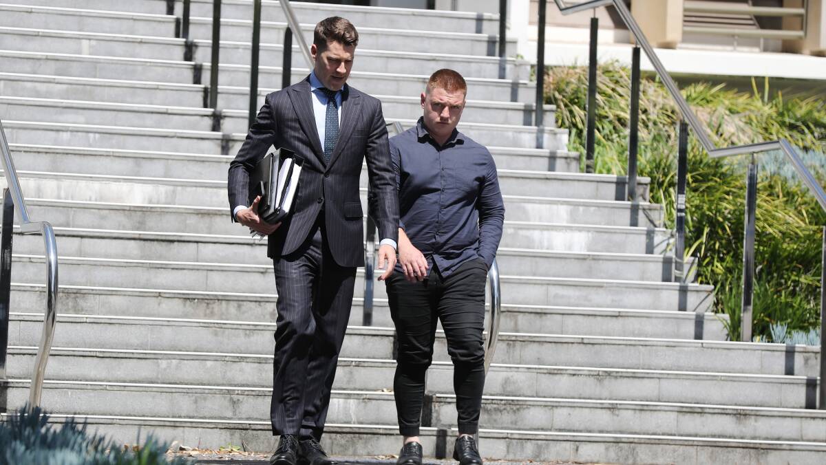 Jamie Keegan (right) departs Wollongong courthouse with defence lawyer Matthew Ward. Picture by ACM