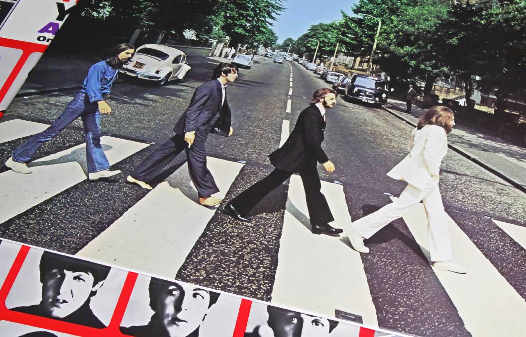 The Beatles were one of five artists to have two albums make the top 100 list. Shutterstock