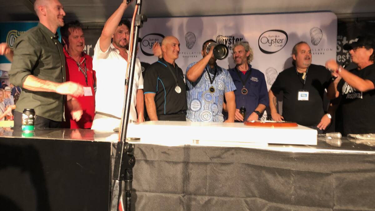 From left Eurobodalla Shire Mayor Mat Hatcher, shucking judge Simon Marnie, comp commentator Colin Fassnidge, second place-getter Jim Yiannaros, Australia's 2023 oyster shucking champion Gerard Doody Dennis, third place getter Greg Carton, shucking judge Martin Bosley and competition MC John Susman. Picture by Marion Williams.