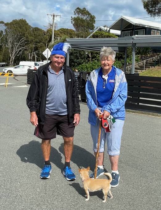 Narooma residents Graham and Marie with their dog Roxy after enjoying their breakfast on the beach at the Narooma Surf Life Saving Club on Australia Day. Picture by Marion Williams