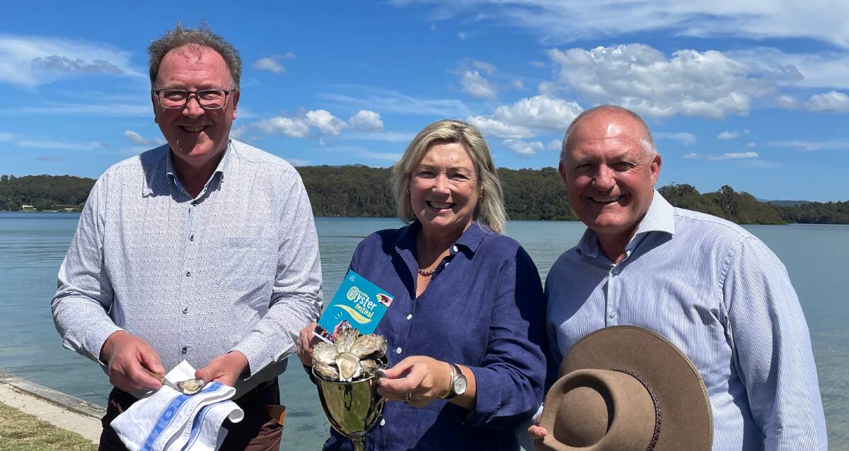 Bega member Dr Michael Holland, Cath Peachey, chair of Narooma Rocks and David Harris, MP, shadow minister for jobs, investment and tourism at Wagonga Inlet on Friday, March 10, announcing a $600,000 commitment over three years to grow the Narooma Oyster Festival. Picture by Marion Williams.