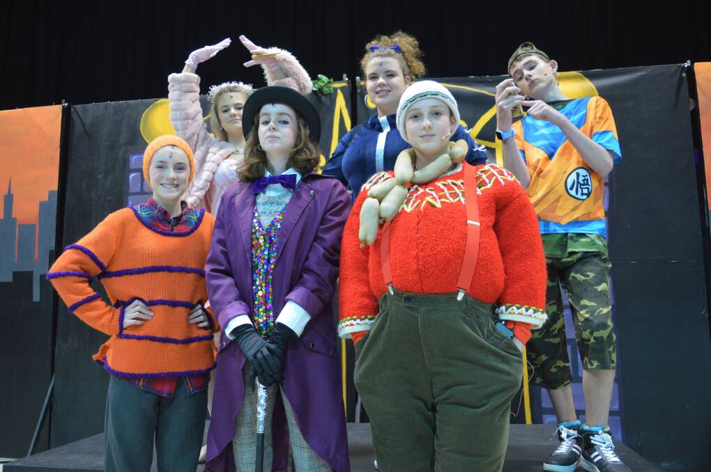 From left: Erin Drewsen as Charlie Bucket, Violet Taylor as Veruca Salt, Raphi Herford as Willy Wonka, Lilly Smyth as Violet Beauregarde, Szaffi Tuska as Augustus Gloop and Justin Murphy as Mike Teevee in Carroll College's upcoming musical production of Charlie and the Chocolate Factory.