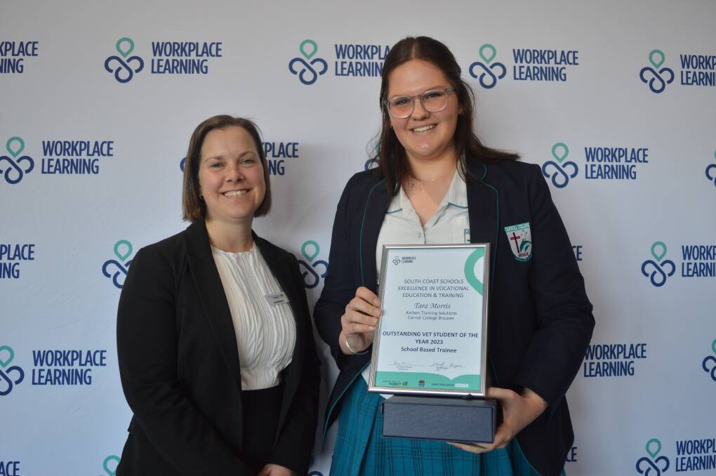 Bec Mackinnon of Apprenticeship Support Australia (left) presented Carroll College student Tara Morris with an Outstanding VET Student of the Year award at Moruya Golf Club on July 26. 