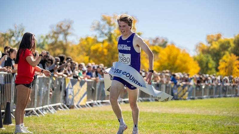 Andrew Amor crosses the finish line running for New Mexico Highlands University. Picture NMHU