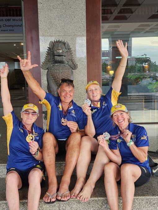 Far South Coast paddlers Julie Salter, Ross Galvin, both from Nature Coast, Moruya, Gill McCallum from Merimbula Water Dragons and Therese Holgate from Nature Coast, celebrating in Thailand. Picture supplied 