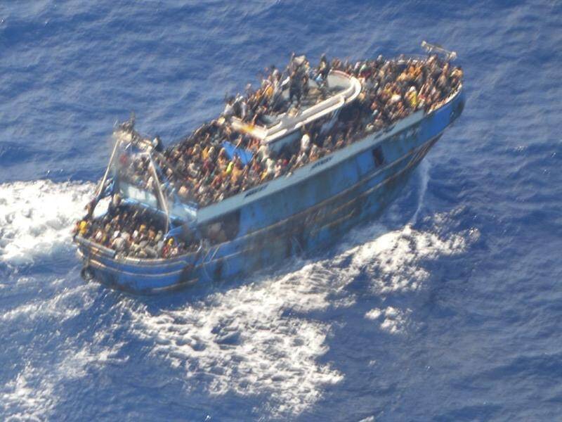 Aerial pictures released by Greek authorities showed dozens of people on the boat's decks. (AP PHOTO)
